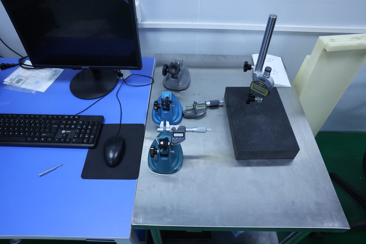Quality control inspection tools including digital micrometers and granite surface plate