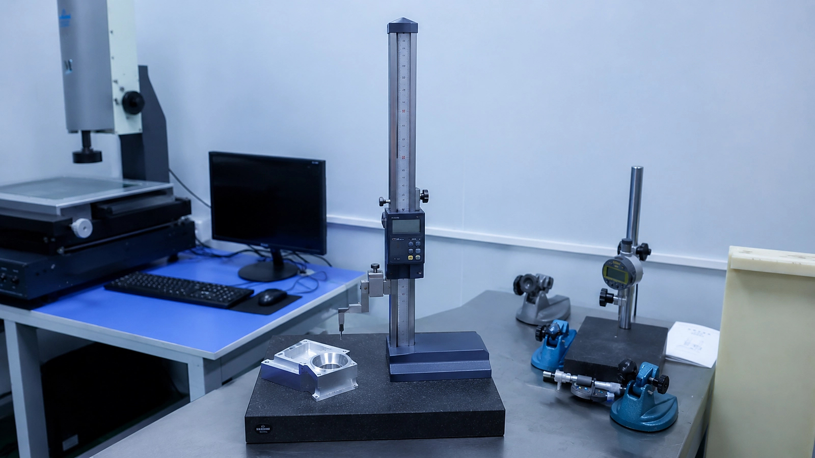 Height gauge and granite surface plate for CNC part inspection